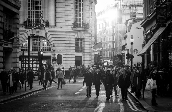 people walking through a busy city